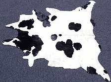 Black & White Cow Steer Hide Rug - Cloud Pattern - Warm your home with the Black & White Cowhide Rug as a centerpiece. A beautiful black and white natural cloud pattern makes this unique rug an impressive, first-grade quality floor covering and is large enough for any living area  cowgirl bedroom decor.