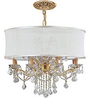 This Crystorama 'Brentwood' chandelier adds elegance to any decor. The twelve-light fixture features a goldtone finish, hand-polished crystal accents, and a sheer white fabric shade. 