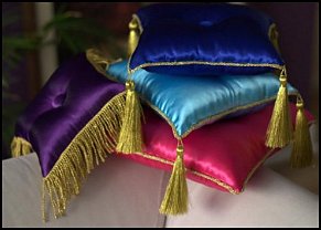 Satin pillows with golden tassels